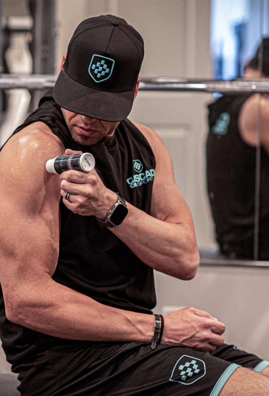 Athlete applying Cascade CBX Sport roll-on